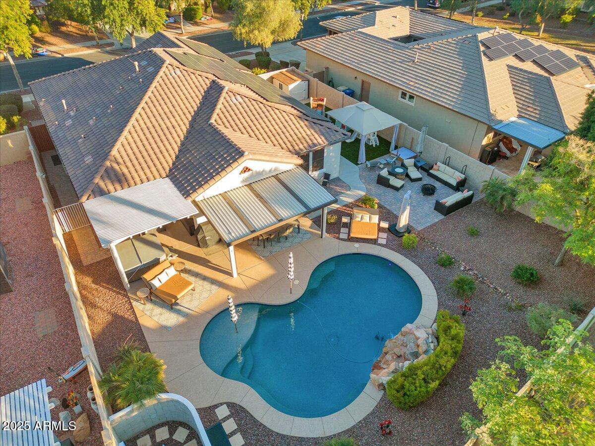 3214 North Springfield Street Buckeye, AZ 85396 - Photo 55 of 64 an aerial view of a house with a swimming pool and outdoor space