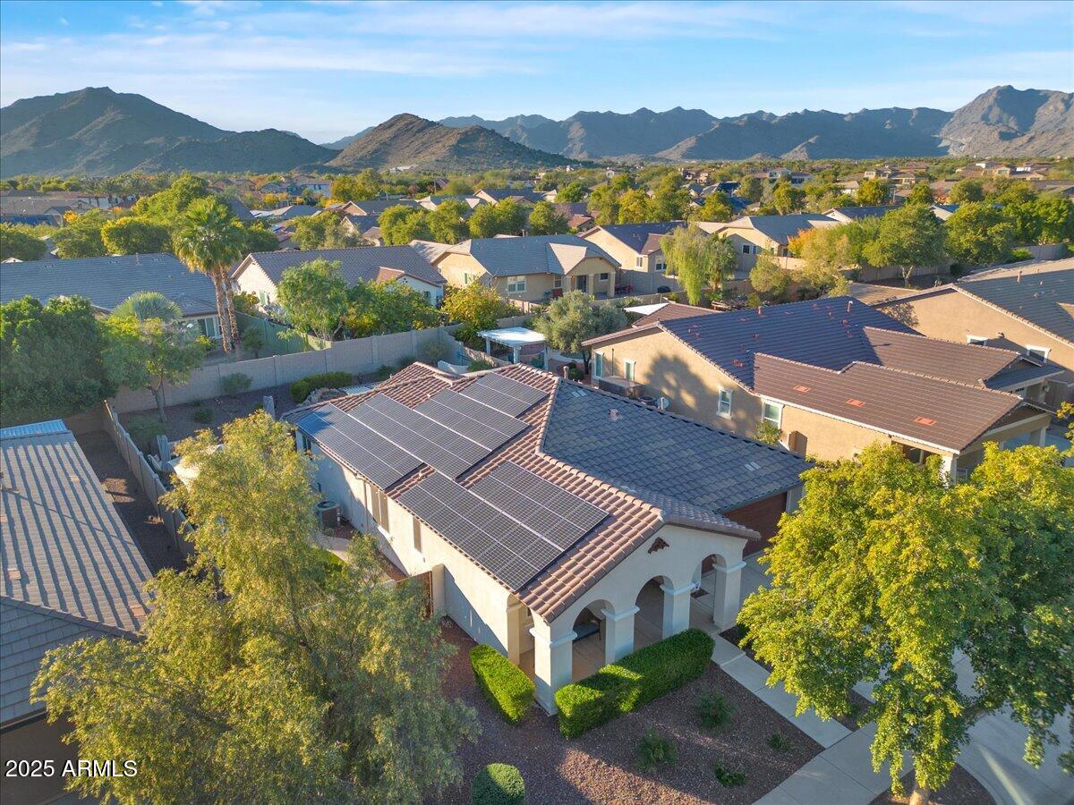 3214 North Springfield Street Buckeye, AZ 85396 - Photo 59 of 64 an aerial view of a house with a mountain