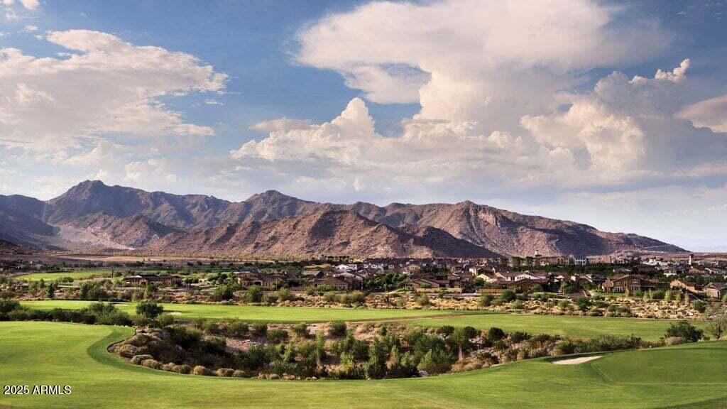 3214 North Springfield Street Buckeye, AZ 85396 - Photo 62 of 64 a view of a city with mountains in the background
