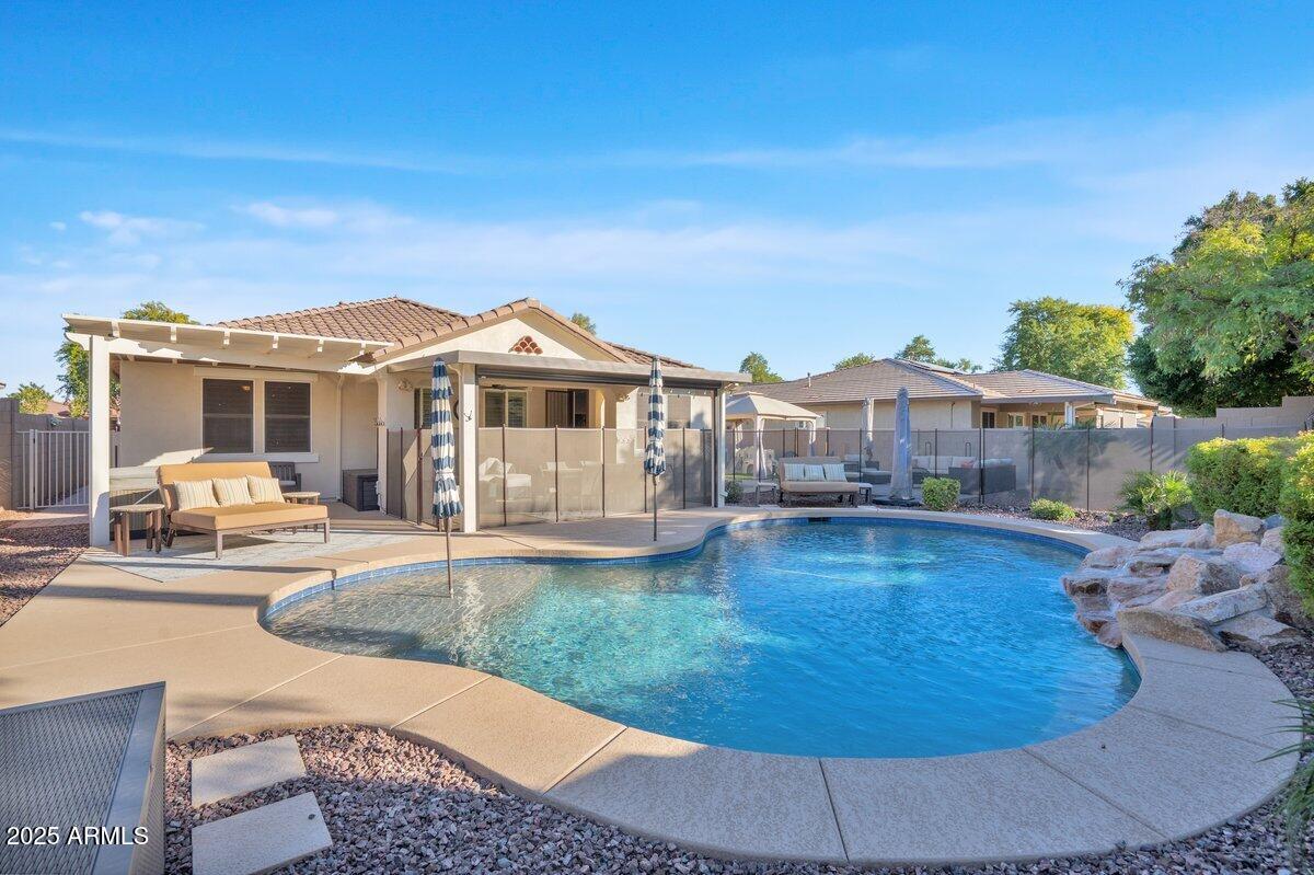 3214 North Springfield Street Buckeye, AZ 85396 - Photo 64 of 64 a view of a house with swimming pool and sitting area