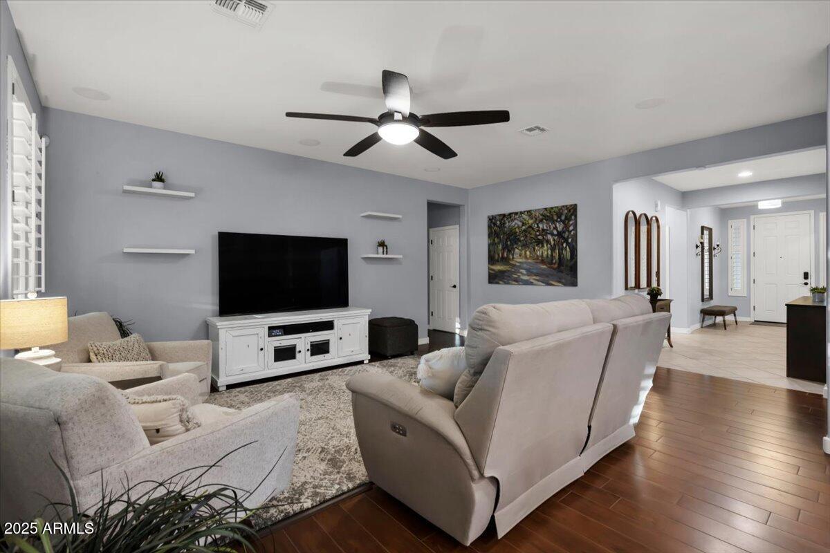 3214 North Springfield Street Buckeye, AZ 85396 - Photo 8 of 64 a living room with furniture and a flat screen tv