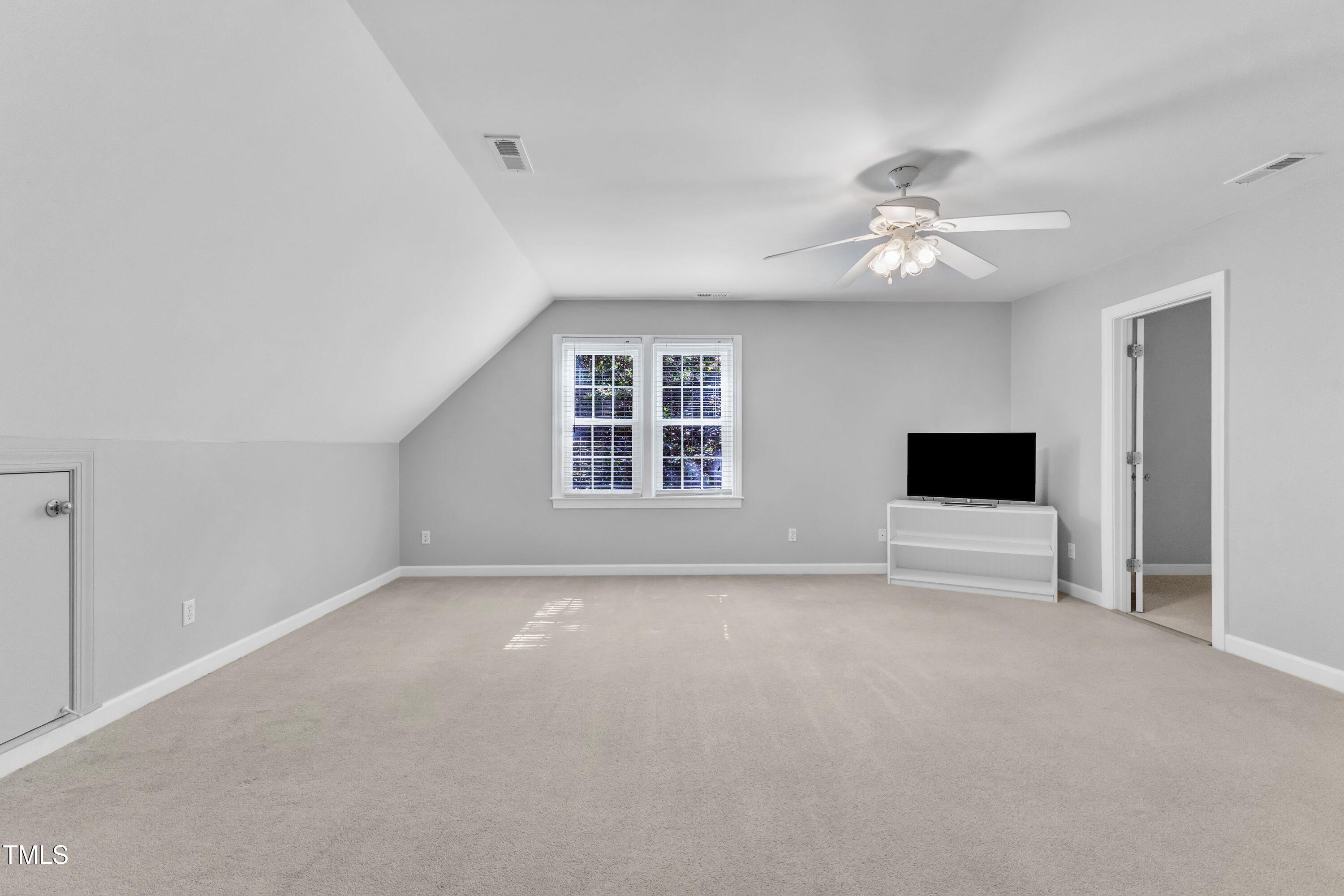 2125 Oakcrest Court Raleigh, NC 27612 - Photo 51 of 74 a view of livingroom with a ceiling fan and window