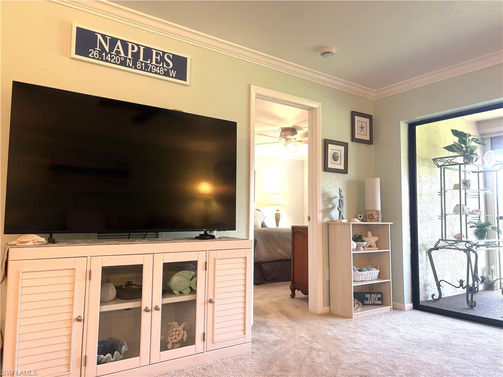 5841 Rattlesnake Hammock Road, Unit I203 Naples, FL 34113 - Photo 15 of 24 a view of an empty room with a flat screen tv