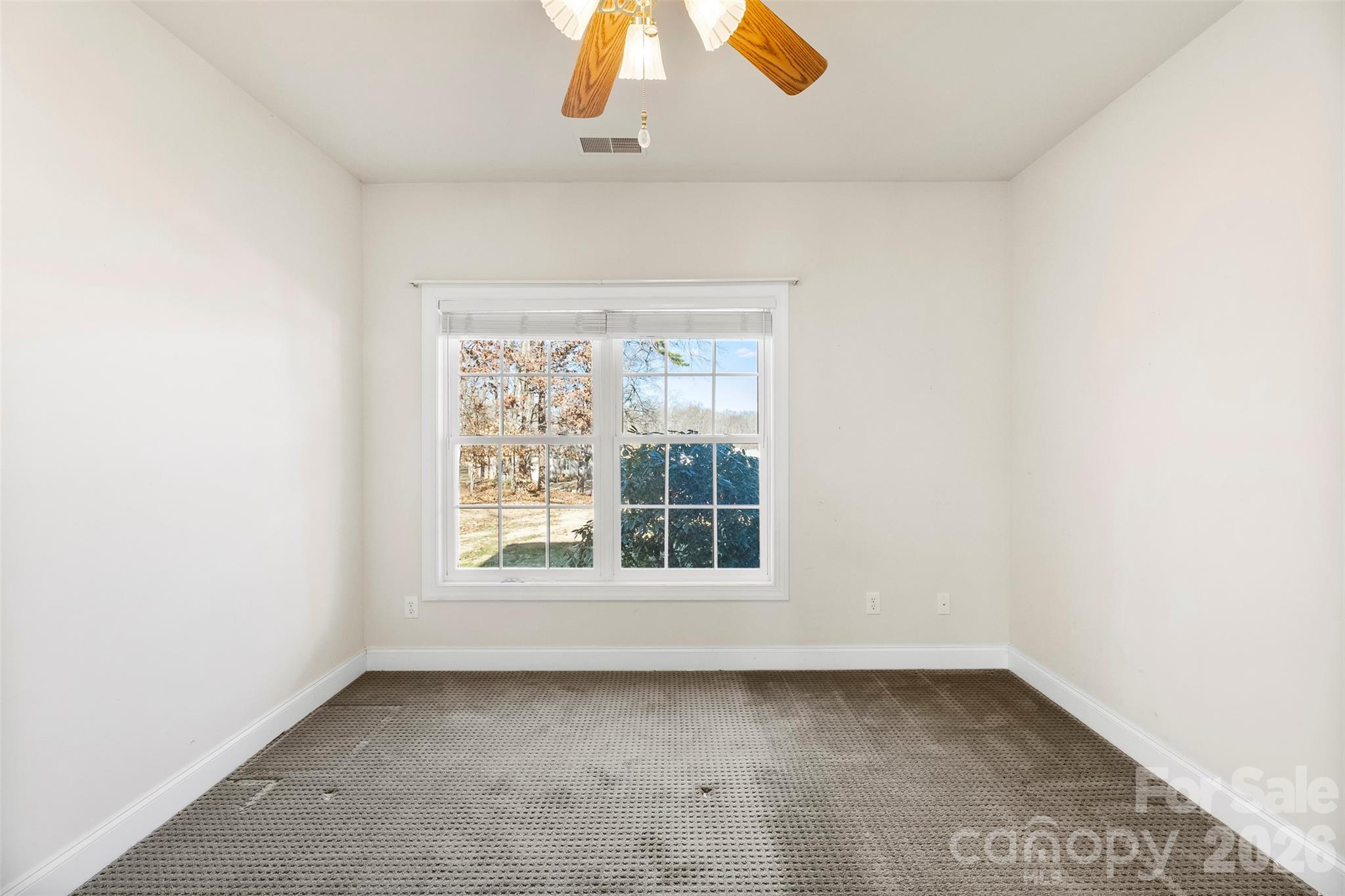 17858 Red Ridge Court Locust, NC 28097 - Photo 12 of 44 an empty room with a window