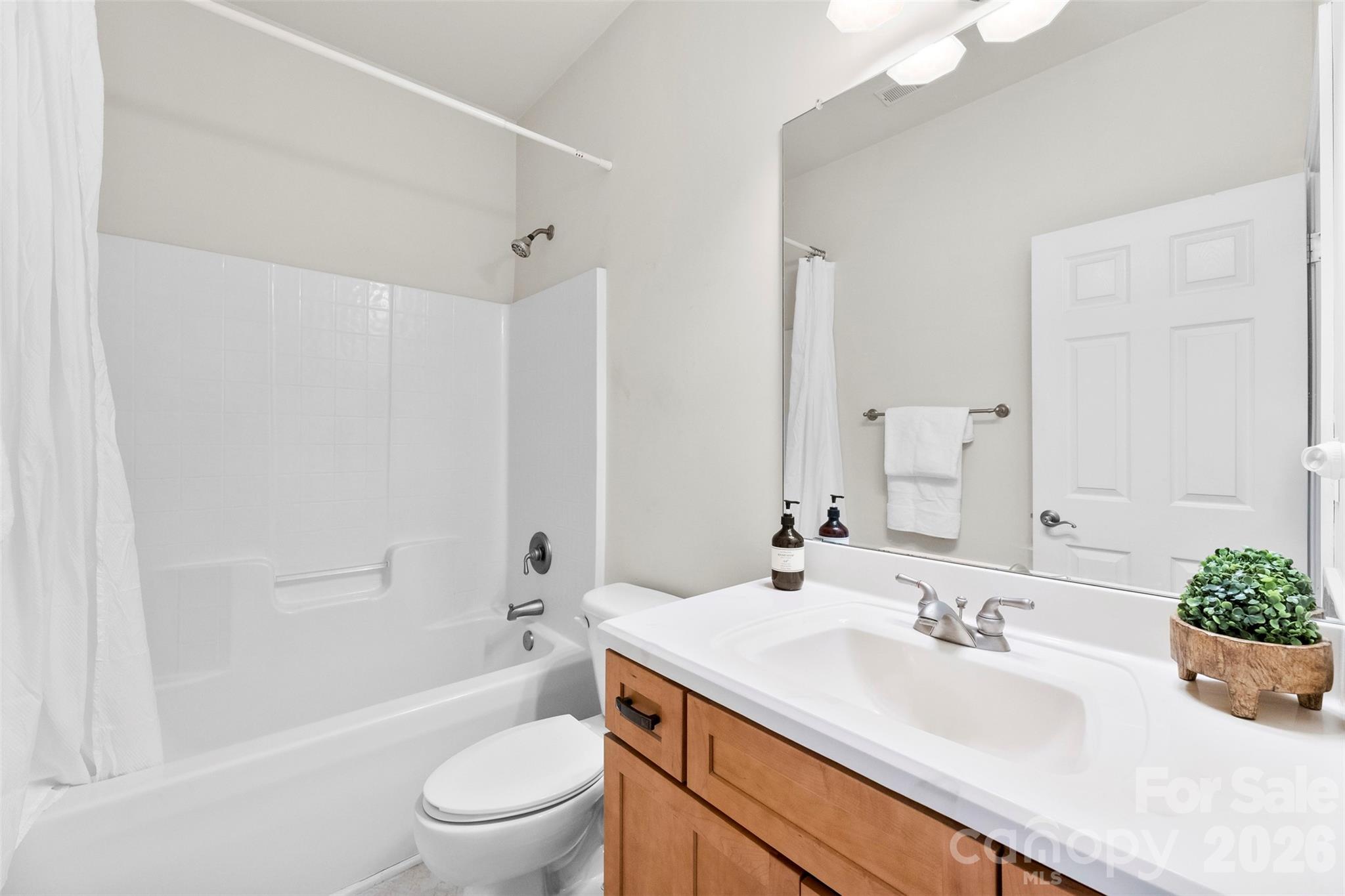 17858 Red Ridge Court Locust, NC 28097 - Photo 14 of 44 a bathroom with a sink a toilet and shower