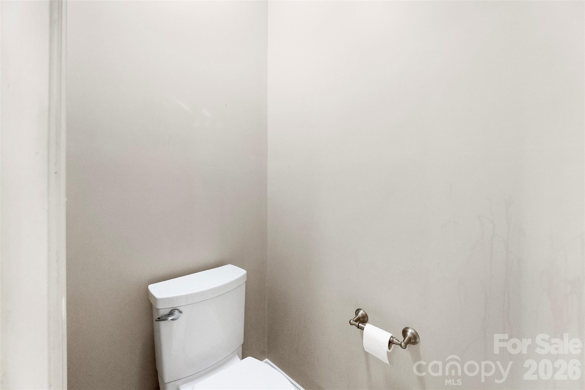 17858 Red Ridge Court Locust, NC 28097 - Photo 29 of 44 a white toilet sitting next to a white wall