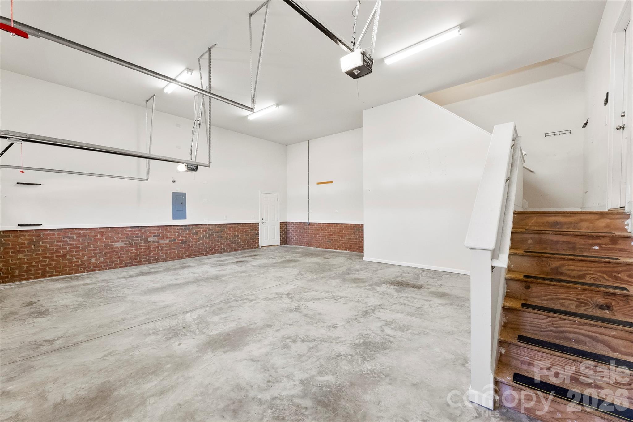 17858 Red Ridge Court Locust, NC 28097 - Photo 32 of 44 a view of a hallway with wooden floor and staircase