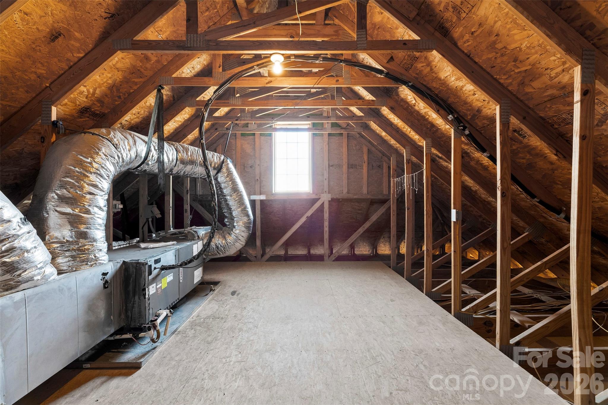 17858 Red Ridge Court Locust, NC 28097 - Photo 34 of 44 a view of walk in closet with clothes and shoes