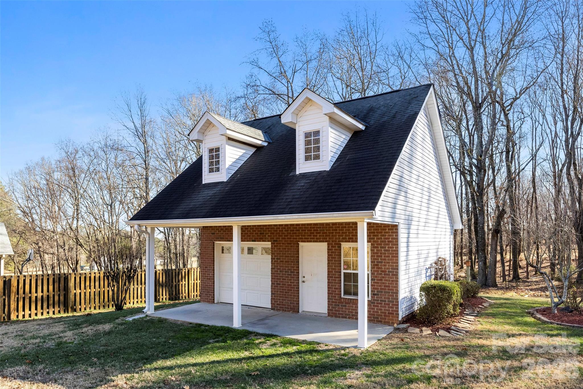17858 Red Ridge Court Locust, NC 28097 - Photo 39 of 44 a front view of a house with a yard