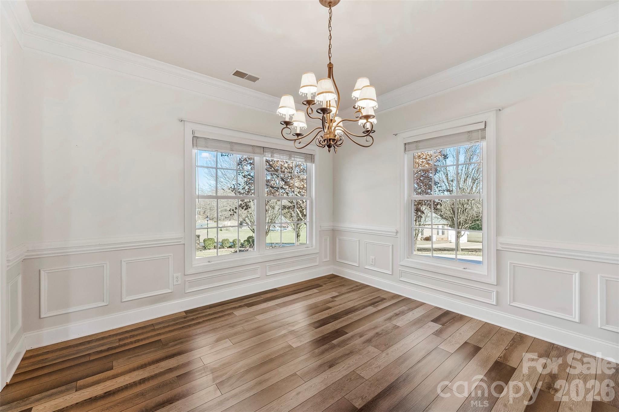 17858 Red Ridge Court Locust, NC 28097 - Photo 6 of 44 a view of an empty room with wooden floor and a window