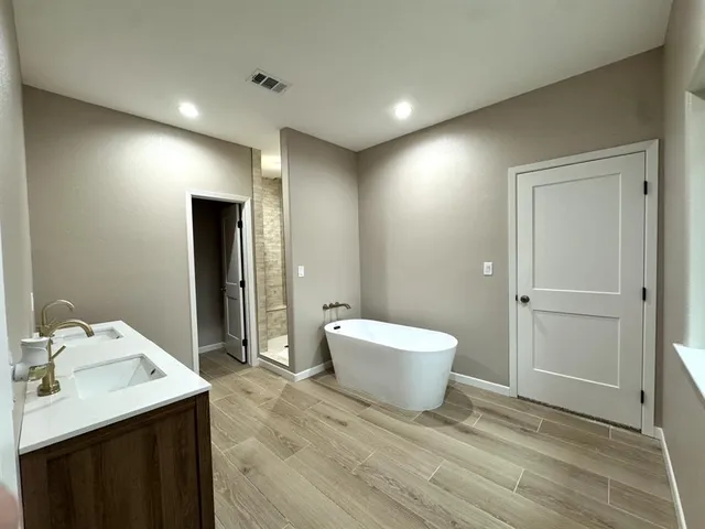 a bathroom with a sink and mirror