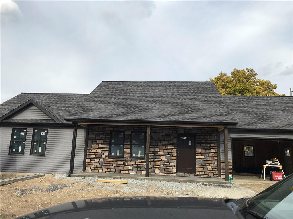 206 Fairview Street Uniontown, PA 15401 - Photo 28 of 29 a front view of a house with a garden