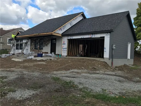 a front view of a house with yard