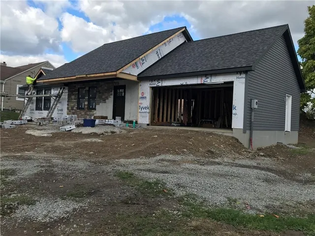 a front view of a house with yard
