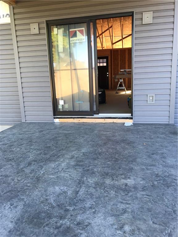 206 Fairview Street Uniontown, PA 15401 - Photo 9 of 29 a view of an empty room with a fireplace and a large window