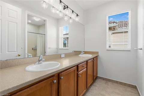 a bedroom with a bed and a chair