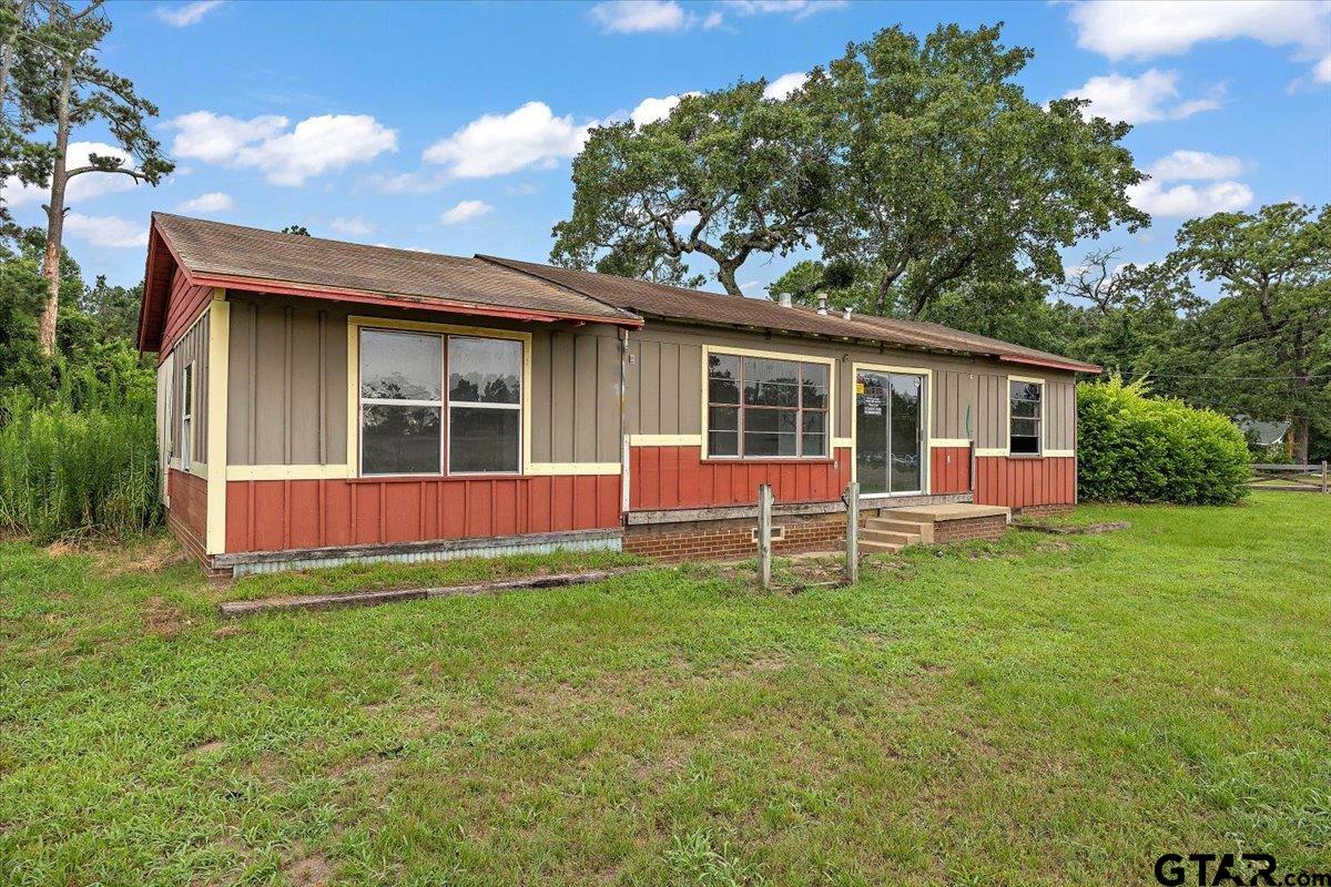 1535 North Dickinson Drive Rusk, TX 75785 - Photo 11 of 18 a view of a house with a yard and sitting area