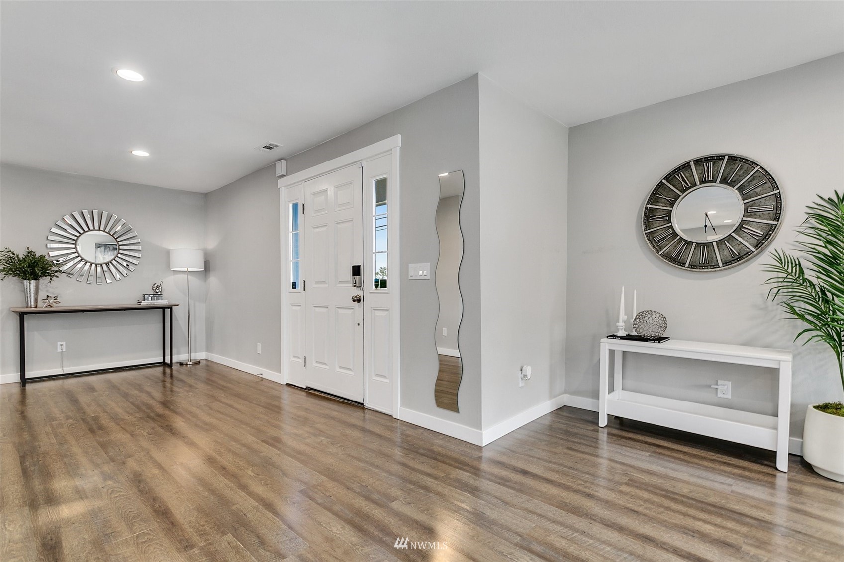 16543 Benson Road South Renton, WA 98055 - Photo 5 of 40 a view of an empty room with wooden floor
