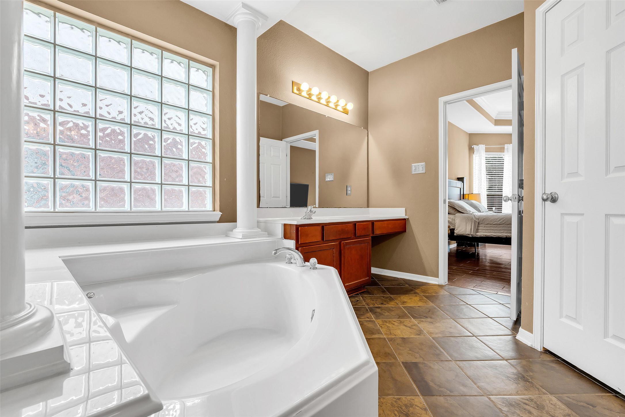 611 River Delta Lane Rosenberg, TX 77469 - Photo 8 of 39 a spacious bathroom with a tub and mirror