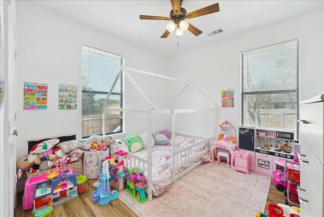 a bedroom with furniture and a baby crib