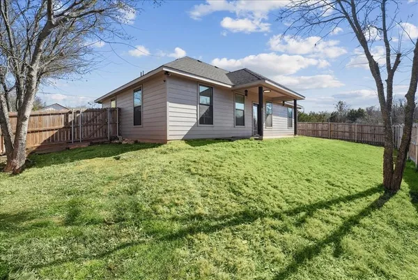 a house view with a garden space