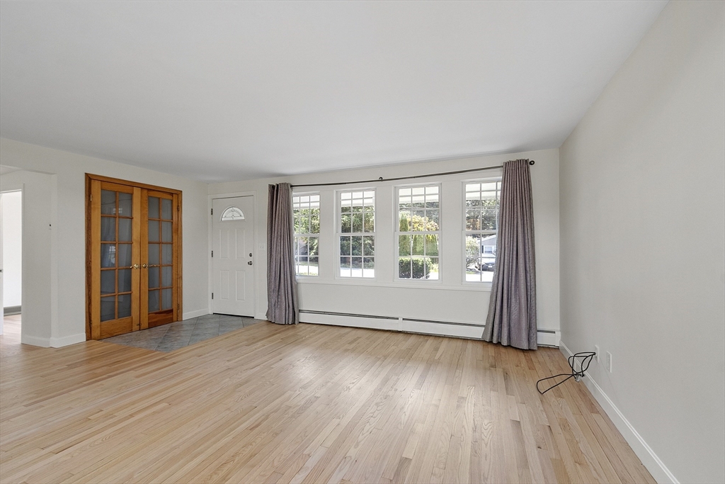 14 Janet Road Chelmsford, MA 01824 - Photo 21 of 36 an empty room with wooden floor and windows