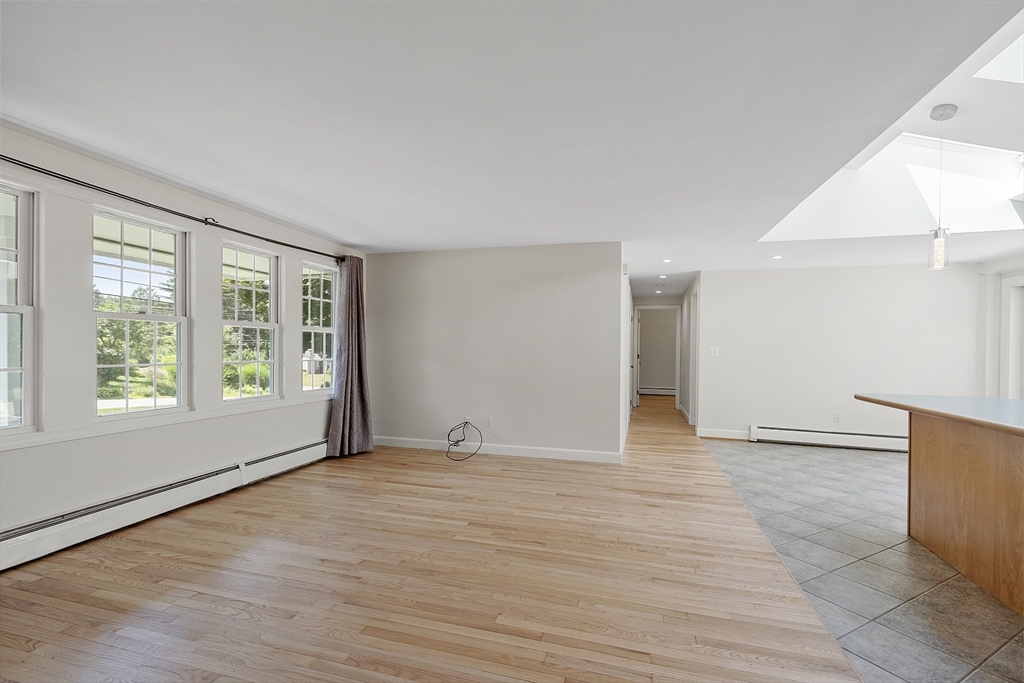 14 Janet Road Chelmsford, MA 01824 - Photo 23 of 36 a view of an empty room with wooden floor and a window