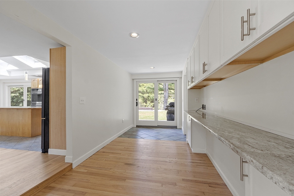 14 Janet Road Chelmsford, MA 01824 - Photo 26 of 36 a view of a hallway with wooden floor and staircase