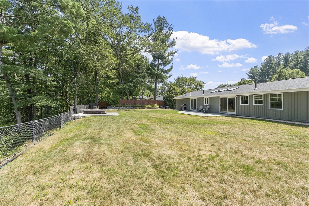 14 Janet Road Chelmsford, MA 01824 - Photo 4 of 36 a swimming pool with trees in the background