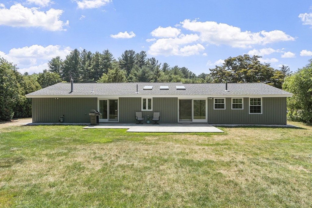 14 Janet Road Chelmsford, MA 01824 - Photo 6 of 36 a front view of a house with a garden
