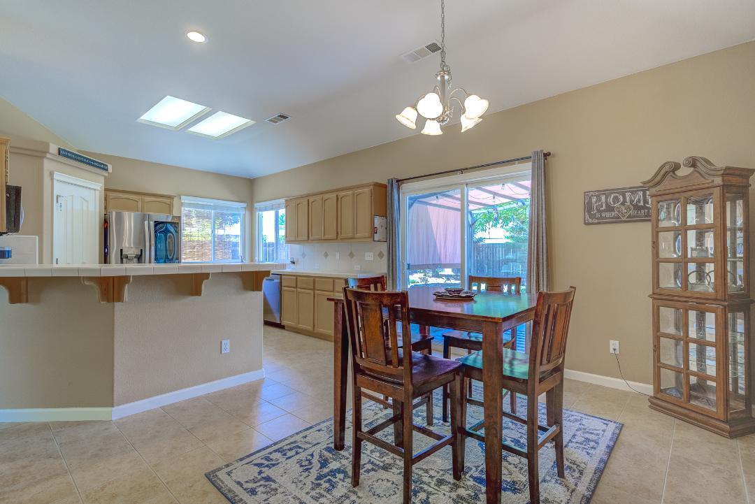 2650 Rhinestone Way Redding, CA 96001 - Photo 10 of 39 a view of a dining room with furniture and a chandelier