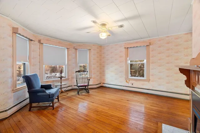 a view of a livingroom with furniture and a window