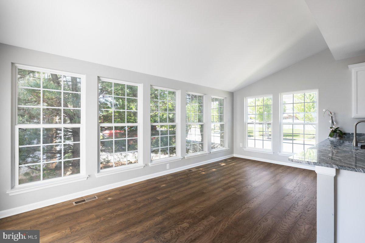 12 Glenbrook Road Ranson, WV 25438 - Photo 13 of 35 a view of an empty room with wooden floor and a window