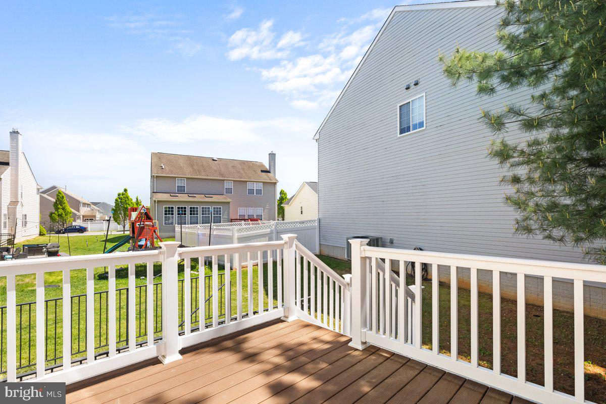 12 Glenbrook Road Ranson, WV 25438 - Photo 15 of 35 a view of a balcony with wooden fence and floor