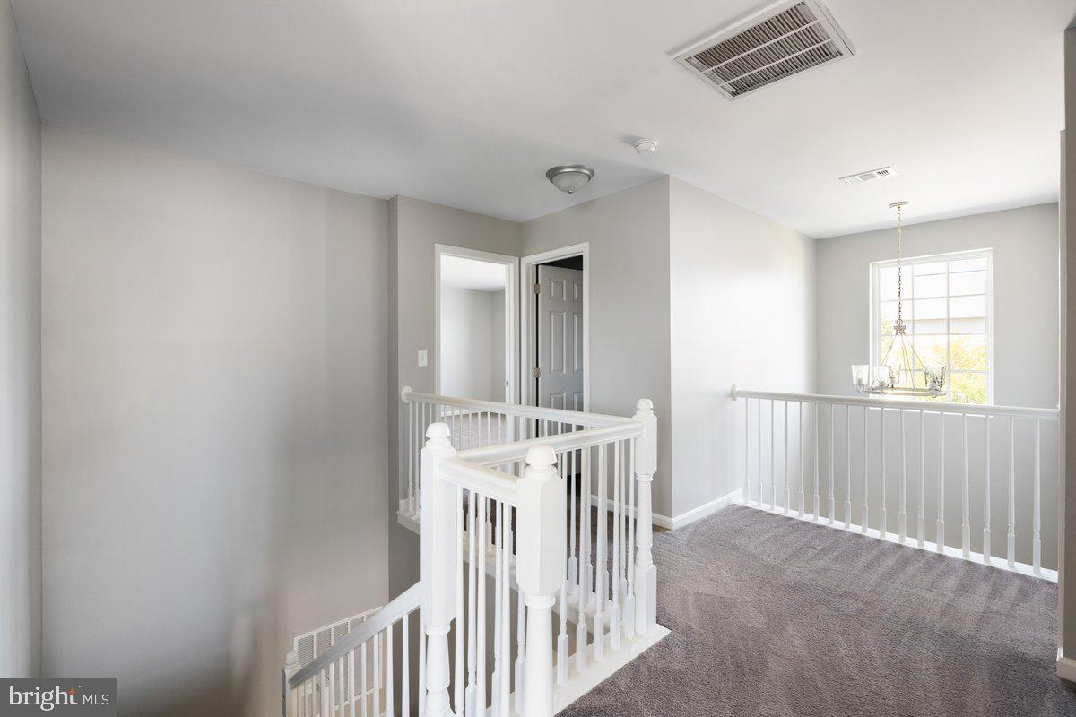 12 Glenbrook Road Ranson, WV 25438 - Photo 22 of 35 a view of a hallway with windows