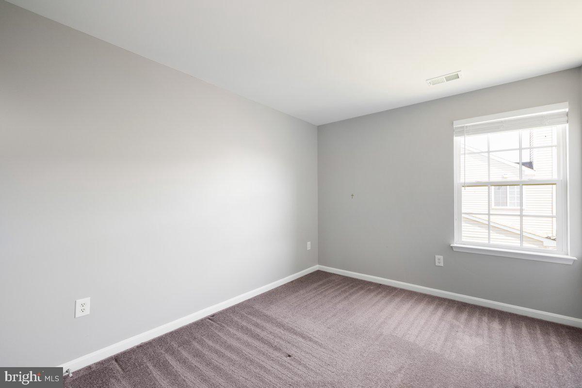 12 Glenbrook Road Ranson, WV 25438 - Photo 25 of 35 wooden floor in an empty room with a window