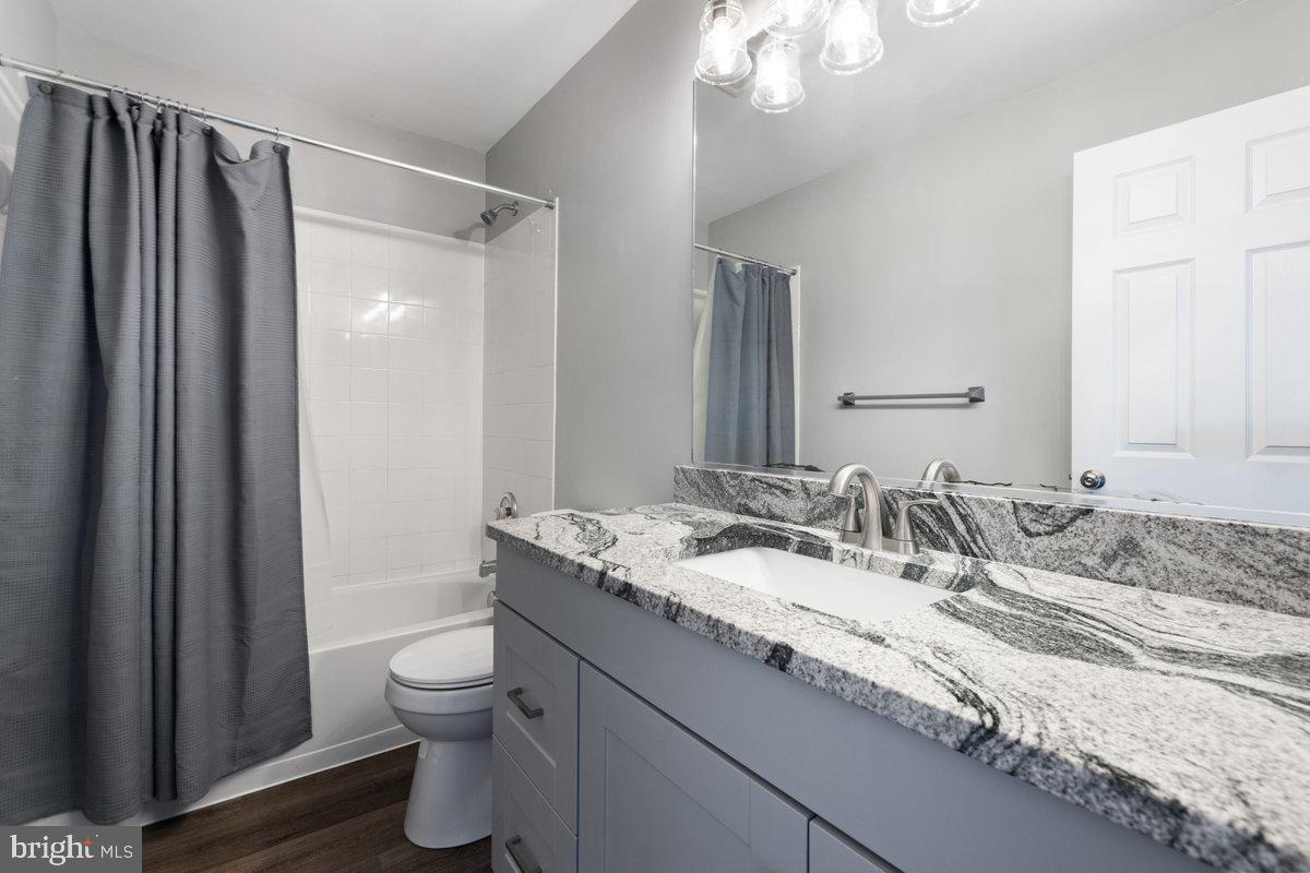 12 Glenbrook Road Ranson, WV 25438 - Photo 26 of 35 a bathroom with a granite countertop sink toilet and shower
