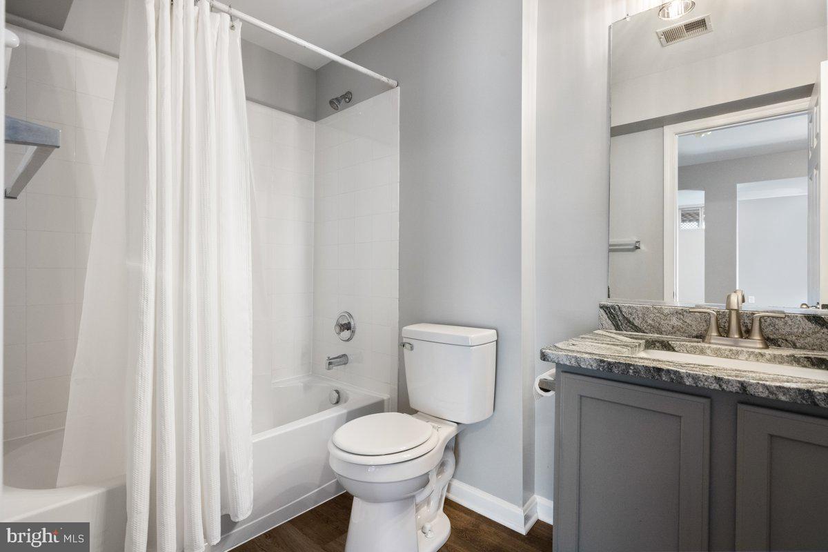 12 Glenbrook Road Ranson, WV 25438 - Photo 29 of 35 a bathroom with a granite countertop toilet and a sink