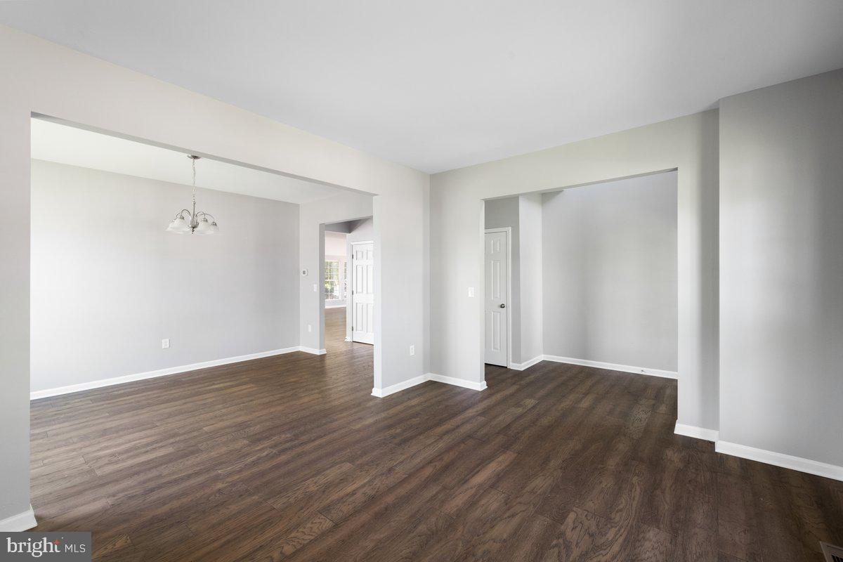 12 Glenbrook Road Ranson, WV 25438 - Photo 3 of 35 a view of an empty room with wooden floor