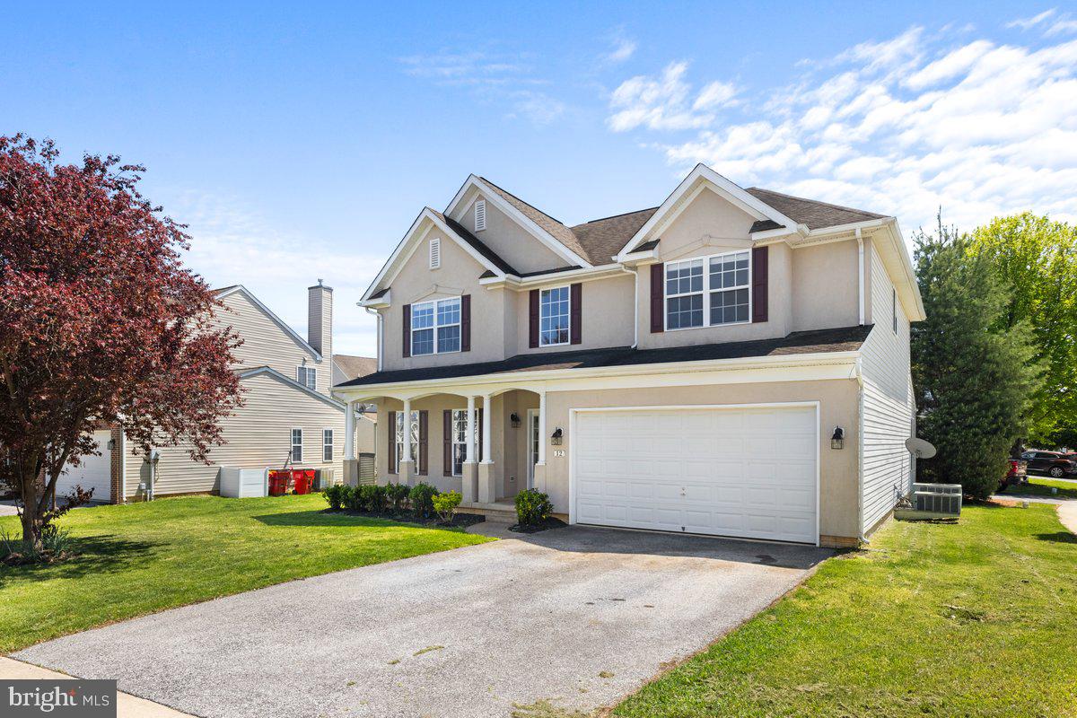 12 Glenbrook Road Ranson, WV 25438 - Photo 34 of 35 a front view of a house with a yard and garage