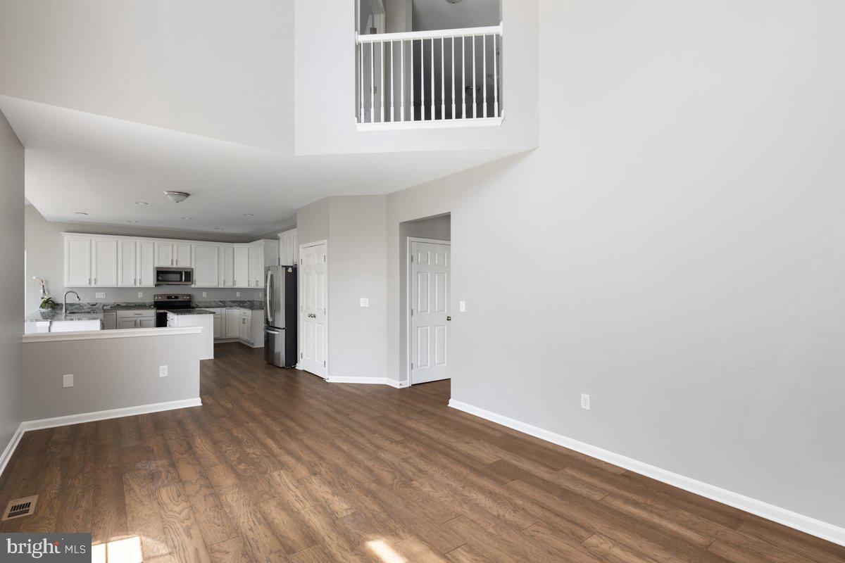 12 Glenbrook Road Ranson, WV 25438 - Photo 8 of 35 a kitchen with cabinets and wooden floor