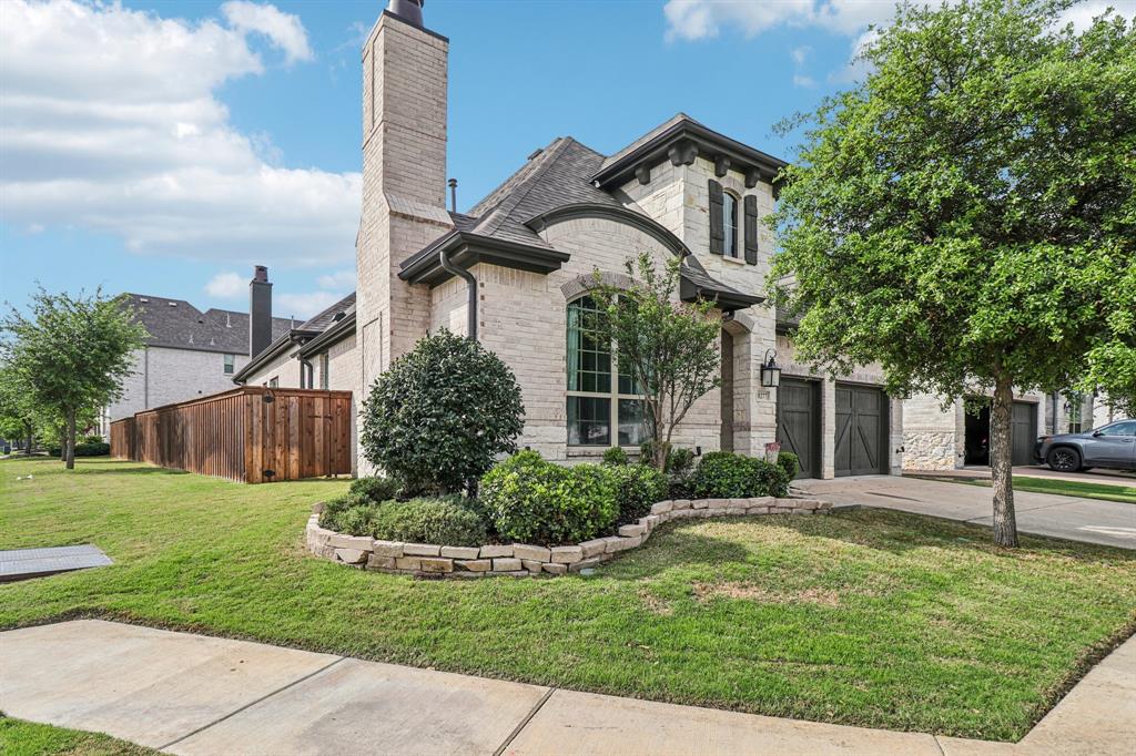 8277 Halifax The Colony, TX 75056 - Photo 2 of 37 a front view of a house with garden