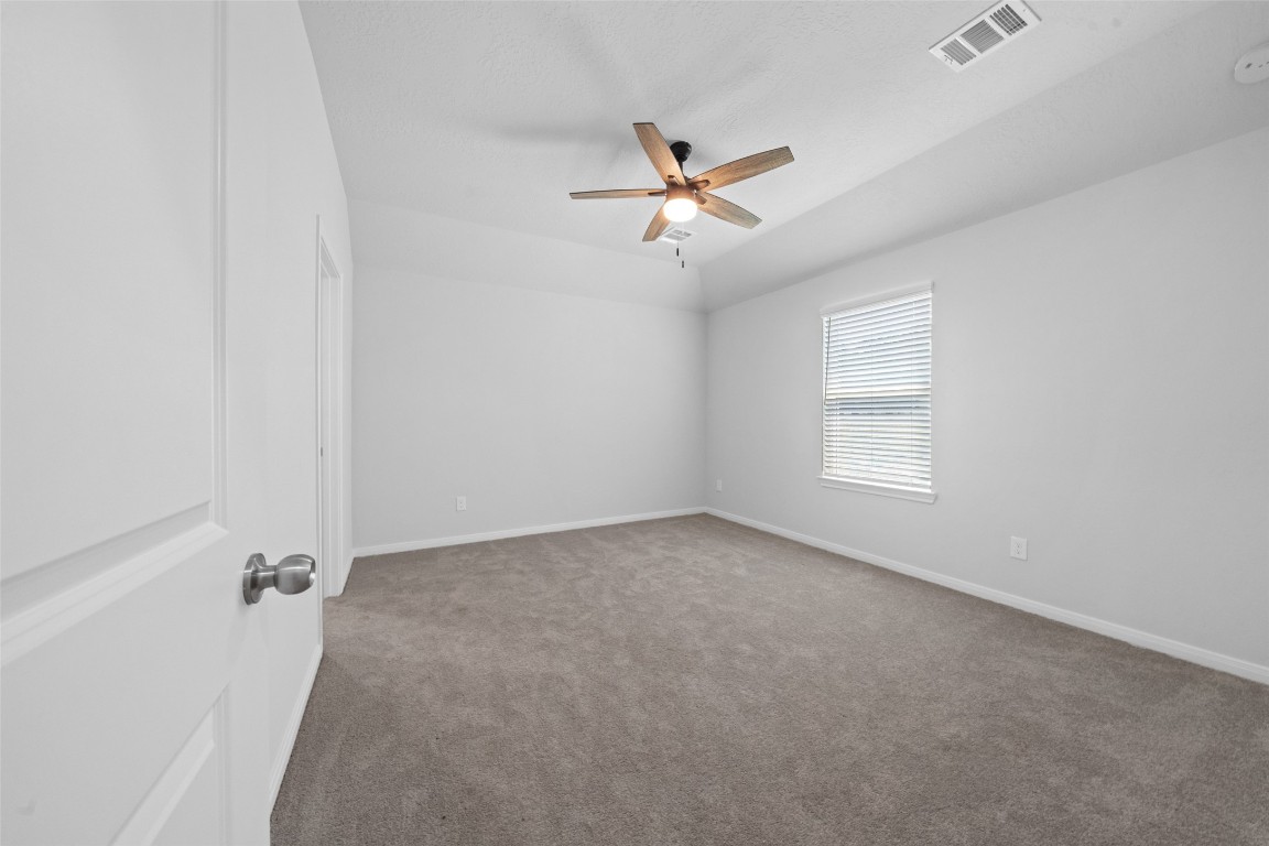 1434 25th Street Hempstead, TX 77445 - Photo 12 of 20 a view of a livingroom with a ceiling fan and window
