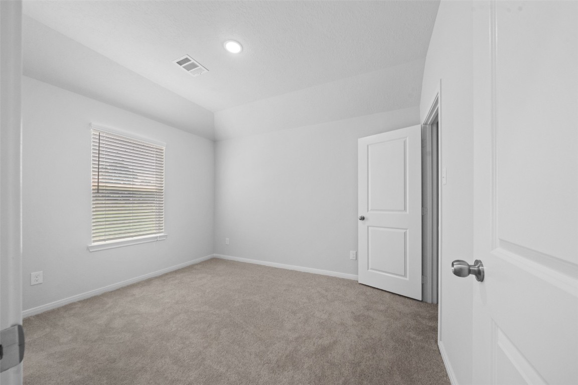 1434 25th Street Hempstead, TX 77445 - Photo 13 of 20 a view of an empty room with a window
