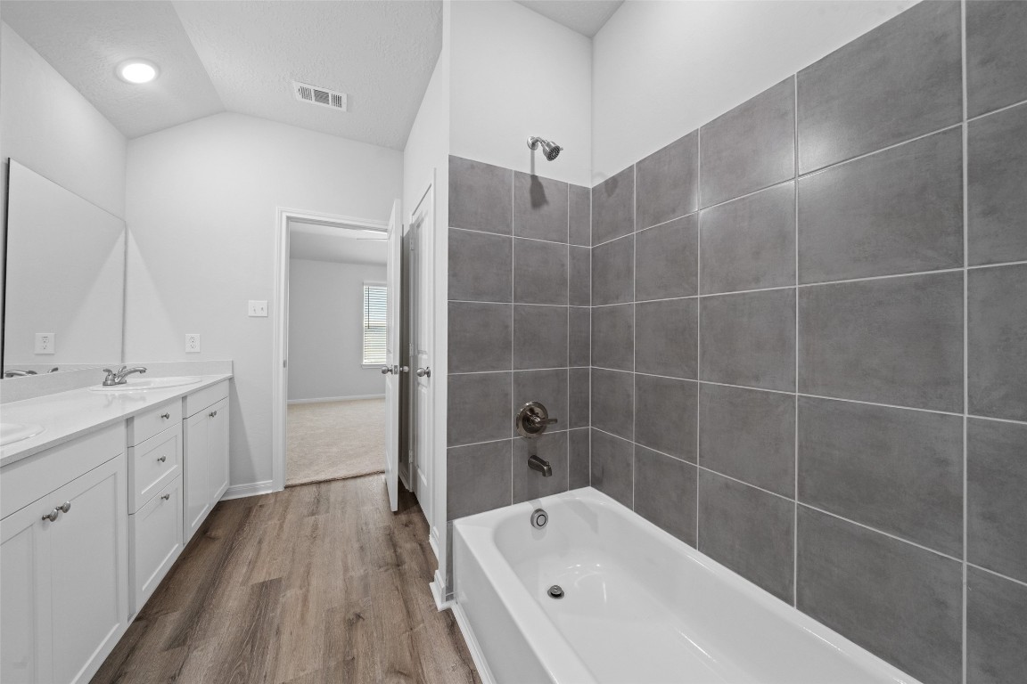 1434 25th Street Hempstead, TX 77445 - Photo 15 of 20 a bathroom with a bathtub and a sink