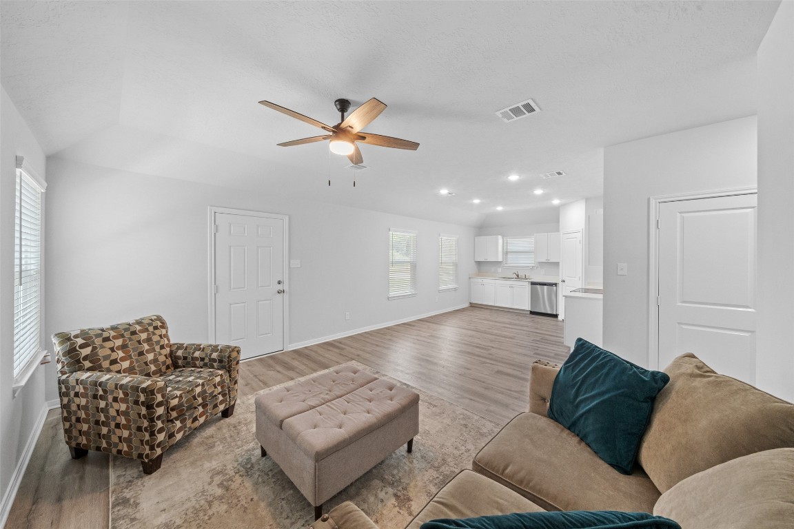 1434 25th Street Hempstead, TX 77445 - Photo 5 of 20 a living room with furniture and a chandelier