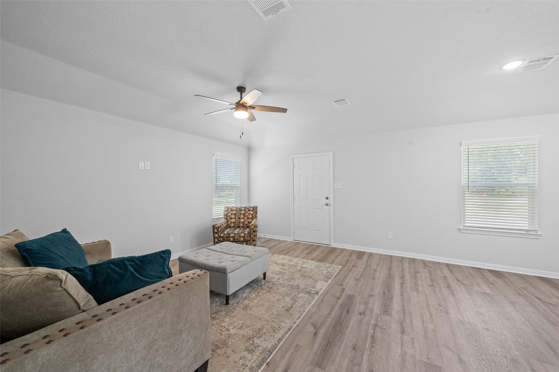 1434 25th Street Hempstead, TX 77445 - Photo 6 of 20 a living room with furniture and a chandelier