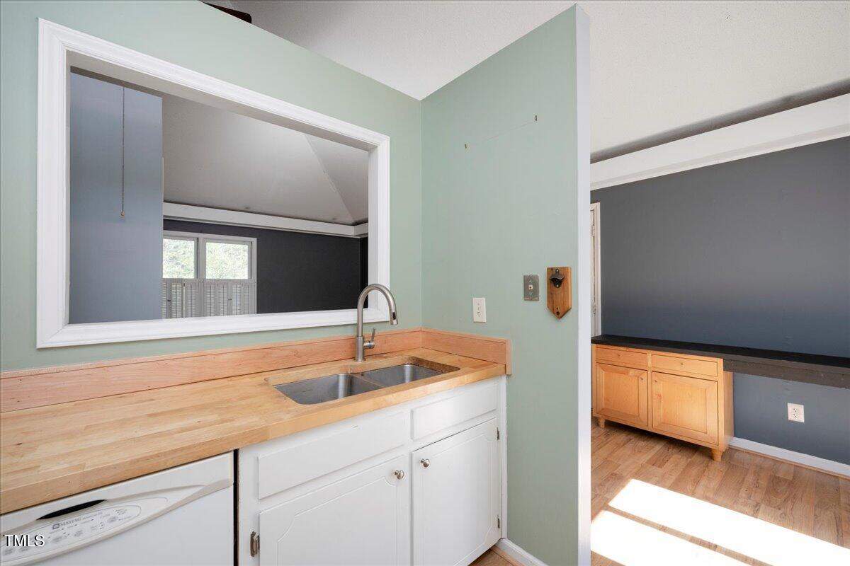 3501 Mill Run Raleigh, NC 27612 - Photo 12 of 24 a bathroom with a sink and a large mirror