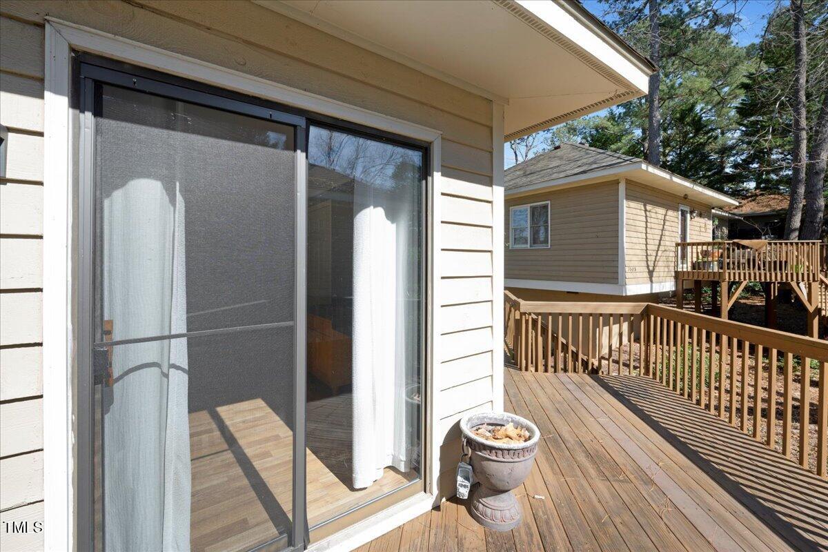 3501 Mill Run Raleigh, NC 27612 - Photo 19 of 24 a view of a porch with wooden floor and fence