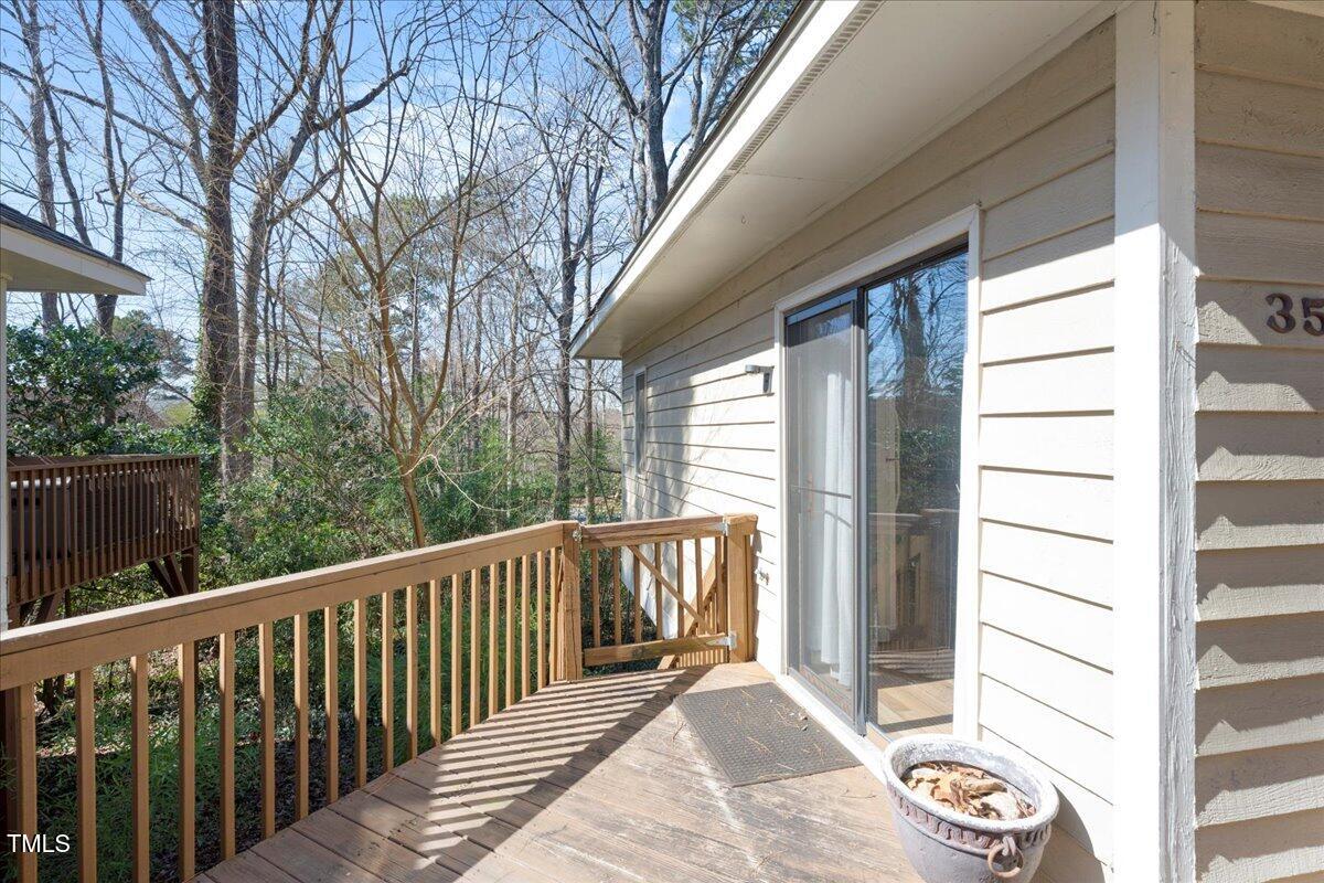 3501 Mill Run Raleigh, NC 27612 - Photo 2 of 24 a view of a balcony with wooden floor